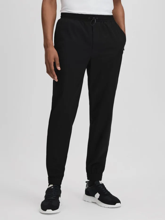 Men Reiss Sweats Hoodies and Joggers Dax Castore Water Repellent Track Pants Onyx Black Men Reiss Sweats Hoodies and Joggers Dax Castore Water Repellent Track Pants Onyx Black